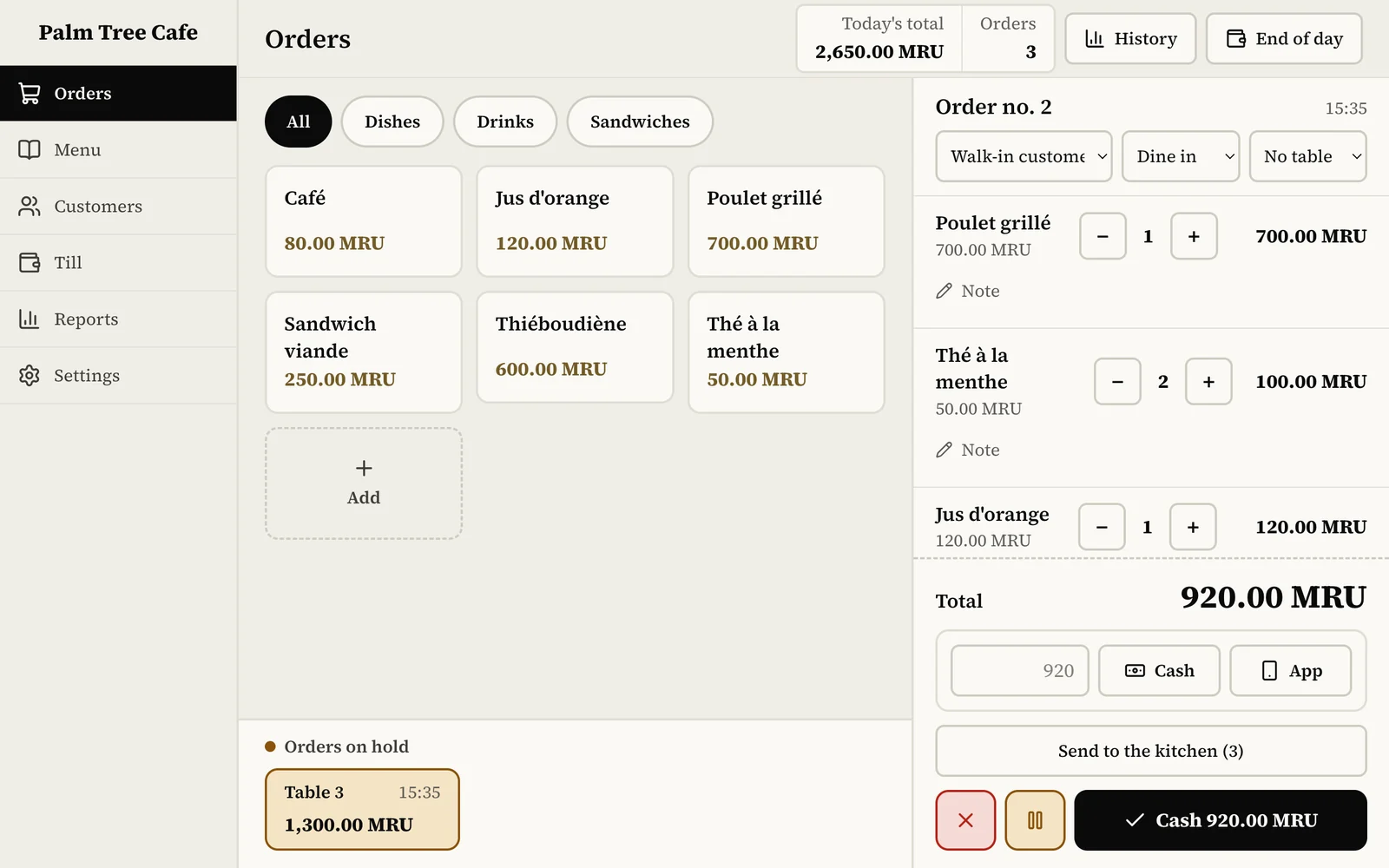 A cafe's till screen in OUAQT software: an order in progress, its total and the payment.
